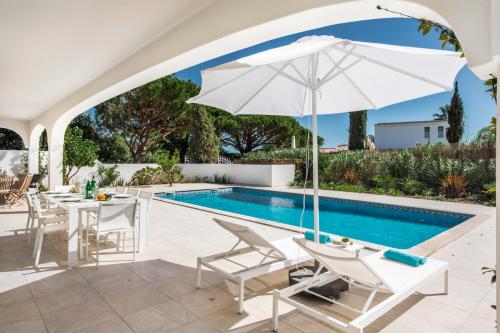 A shaded spot near the pool outside the villa