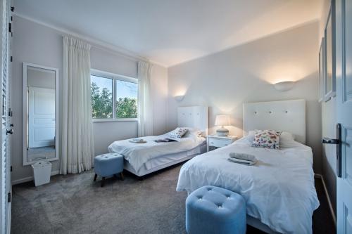 One of the spacious twin bedrooms with luxury bedding